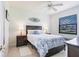 Comfortable bedroom with a ceiling fan and blue-themed decor at 2105 Deborah Dr, Punta Gorda, FL 33950