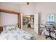 Cozy bedroom with built-in Murphy bed, desk, and view of kitchen and living area at 2105 Deborah Dr, Punta Gorda, FL 33950