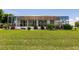 Landscaped backyard with a screened-in pool and patio at 2105 Deborah Dr, Punta Gorda, FL 33950