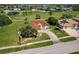 Charming single-story home with well-manicured lawn and a long driveway in a golf community at 2105 Deborah Dr, Punta Gorda, FL 33950