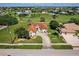 Charming single-story home with well-manicured lawn and a long driveway in a golf community at 2105 Deborah Dr, Punta Gorda, FL 33950