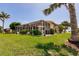Backyard view of a screened-in pool and patio area at 2105 Deborah Dr, Punta Gorda, FL 33950