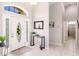 Foyer showcasing a decorative front door, high ceilings, and tile flooring at 2105 Deborah Dr, Punta Gorda, FL 33950