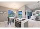 Open kitchen with modern appliances and dining area with sliding glass doors to backyard at 2105 Deborah Dr, Punta Gorda, FL 33950