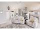Open-concept living area with neutral tones, tile floors, and a view of the entryway at 2105 Deborah Dr, Punta Gorda, FL 33950