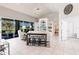 Living room featuring tile floors, built-in shelving, and sliding glass doors to the lanai at 2105 Deborah Dr, Punta Gorda, FL 33950