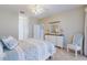 Comfortable main bedroom featuring tile floors, dresser, and ceiling fan at 2105 Deborah Dr, Punta Gorda, FL 33950
