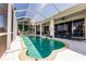 Outdoor screened pool with comfortable lounge chairs at 2105 Deborah Dr, Punta Gorda, FL 33950