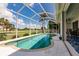 Screened-in pool and lanai area with outdoor furniture, providing a private and relaxing space at 2105 Deborah Dr, Punta Gorda, FL 33950