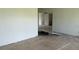 Open-concept layout featuring tile flooring and freshly painted walls, perfect for customization at 214 W Grace St, Punta Gorda, FL 33950