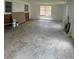 Expansive room with multiple windows, perfect for renovation at 214 W Grace St, Punta Gorda, FL 33950