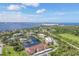 Community aerial view showcasing pond, golf course, and views of the Gulf Coast at 23465 Harborview Rd # 214, Punta Gorda, FL 33980