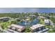 Beautiful aerial view of the community featuring a lake with fountains and lush landscaping, near the water at 23465 Harborview Rd # 214, Punta Gorda, FL 33980