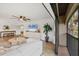 Inviting living room featuring a large sliding glass door to the balcony and modern decor at 23465 Harborview Rd # 214, Punta Gorda, FL 33980