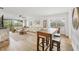 Bright and airy living room with modern decor, dining table, and large windows offering scenic views at 23465 Harborview Rd # 214, Punta Gorda, FL 33980