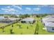 Aerial view of home showcasing the spacious backyard and screened-in patio at 24348 Nicobar Ln, Punta Gorda, FL 33955