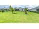 Expansive backyard with a well-manicured lawn and minimal landscaping at 24348 Nicobar Ln, Punta Gorda, FL 33955