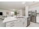 Open concept kitchen featuring a large island, stainless steel appliances, and an integrated dishwasher at 24348 Nicobar Ln, Punta Gorda, FL 33955