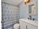 Cozy bathroom featuring a shower with bathtub and updated vanity at 25082 Harborview Rd, Punta Gorda, FL 33980