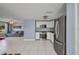Stylish kitchen featuring white cabinetry, stainless steel appliances, and tile flooring at 25082 Harborview Rd, Punta Gorda, FL 33980