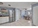 Updated kitchen with stainless steel refrigerator and eat in dining area at 25082 Harborview Rd, Punta Gorda, FL 33980
