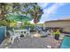 Outdoor patio area with a dining table, chairs, and grill, creating an inviting space for gatherings at 25082 Harborview Rd, Punta Gorda, FL 33980