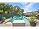 Spacious in-ground pool with brick patio and lush surroundings for backyard enjoyment at 25082 Harborview Rd, Punta Gorda, FL 33980