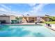 Backyard pool and patio area perfect for outdoor entertaining and relaxation under the covered porch at 25082 Harborview Rd, Punta Gorda, FL 33980