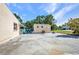 Exterior view of shed and basketball hoop, providing extra storage and recreational options in the backyard at 25082 Harborview Rd, Punta Gorda, FL 33980