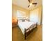 Bedroom with natural light offers a cozy retreat featuring a ceiling fan, bedside tables, and neutral accents at 25224 Lahore Ln, Punta Gorda, FL 33983