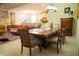 Inviting dining area showcasing a spacious table with comfortable seating, seamlessly connected to the living area at 25224 Lahore Ln, Punta Gorda, FL 33983