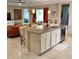Stylish kitchen island featuring pendant lighting, bar stool seating and granite countertops, perfect for entertaining at 25224 Lahore Ln, Punta Gorda, FL 33983