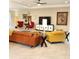Comfortable living room with bright furnishings, a ceiling fan and artistic decor, creating a cozy atmosphere at 25224 Lahore Ln, Punta Gorda, FL 33983
