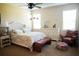 Serene bedroom retreat with neutral tones, plush bedding and ample natural light, creating a peaceful ambiance at 25224 Lahore Ln, Punta Gorda, FL 33983