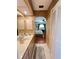 Bathroom with tile floors, a vanity, and a view into the bedroom at 2526 Brazilia Ct, Punta Gorda, FL 33950