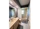 Bathroom featuring tub with shower, vanity and framed mirror at 2526 Brazilia Ct, Punta Gorda, FL 33950