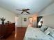 Spacious bedroom with wood floors, ceiling fan, and bright window at 2526 Brazilia Ct, Punta Gorda, FL 33950