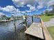The concrete dock has a boat lift and easy access to the waterfront at 2526 Brazilia Ct, Punta Gorda, FL 33950