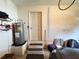 Garage interior showcasing the water heater and a door with small steps leading to it at 2526 Brazilia Ct, Punta Gorda, FL 33950