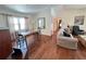 Open-concept living and dining area with hardwood floors and lots of windows at 2526 Brazilia Ct, Punta Gorda, FL 33950