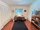 Office features wood floors, desk, bookshelves, closet, and natural light from the window at 2526 Brazilia Ct, Punta Gorda, FL 33950