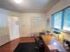 Bright office space with wood floors, built-in desk, and plenty of natural light at 2526 Brazilia Ct, Punta Gorda, FL 33950