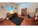 Bright office space with wood floors, built-in bookcase, and plenty of natural light at 2526 Brazilia Ct, Punta Gorda, FL 33950