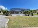 Spacious screened in patio in a manicured back yard at 2526 Brazilia Ct, Punta Gorda, FL 33950