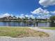 Waterfront view of adjacent houses and private boat lift on canal at 2526 Brazilia Ct, Punta Gorda, FL 33950