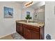 Modern bathroom with dual vanity and a glass-enclosed shower at 25272 E Lenox Cir, Punta Gorda, FL 33950
