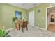 Neutral toned room featuring a window, decorations, ceiling fan, and doorway leading to other rooms at 25272 E Lenox Cir, Punta Gorda, FL 33950