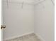 Walk-in closet with carpeted floors and wire shelving at 25272 E Lenox Cir, Punta Gorda, FL 33950