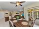 Open dining area extends to an enclosed lanai and features an open connection to the kitchen and living room at 25272 E Lenox Cir, Punta Gorda, FL 33950