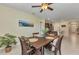 Dining area includes a rustic wood table with seating for four, connecting to the kitchen at 25272 E Lenox Cir, Punta Gorda, FL 33950